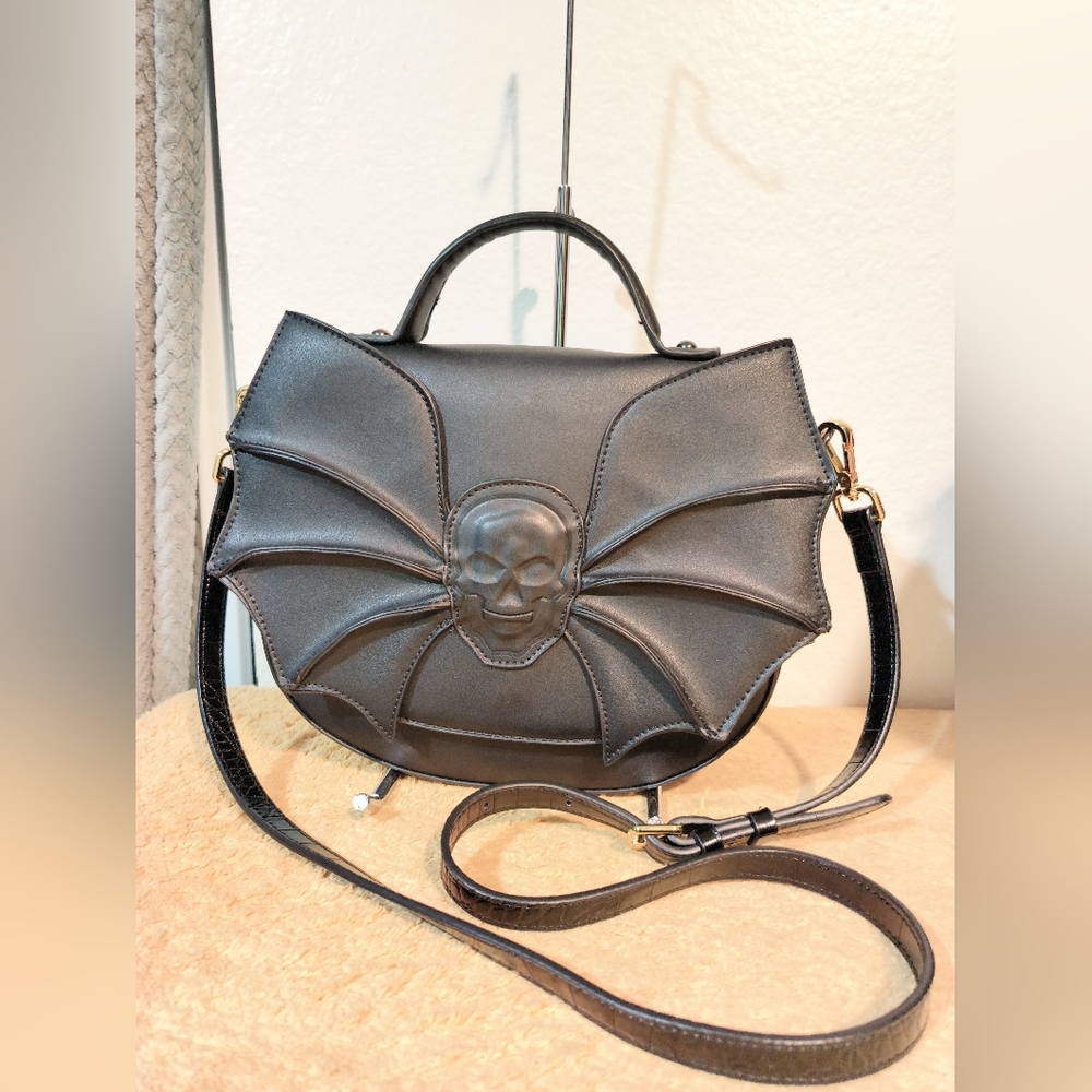 SOLD Banned Apparel Black Gothic Bat Wing Embossed Skull Crossbody Bag.